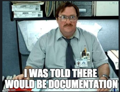 Office worker with cluttered desk and humorous caption
