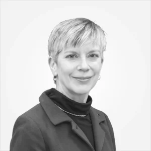 Black-and-white professional headshot of short-haired woman